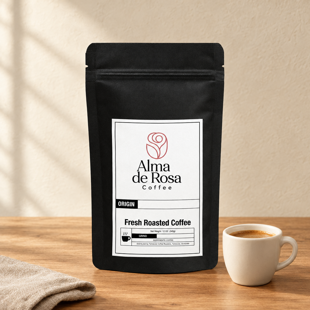 Alma de Rosa single-serve Coffee Capsules pouch on natural oak with an ivory espresso cup and linen