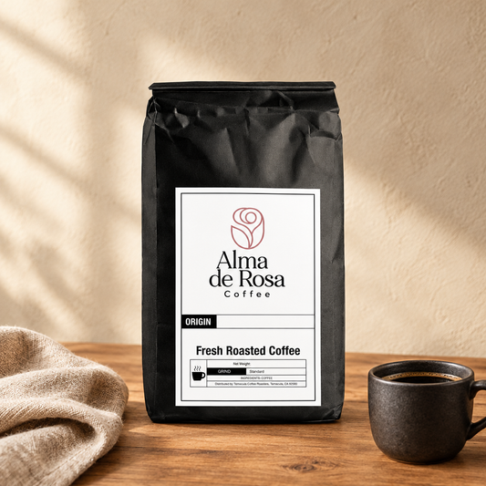 Alma de Rosa Coffee with Mushrooms Dark Roast bag on natural oak with a charcoal coffee cup and linen