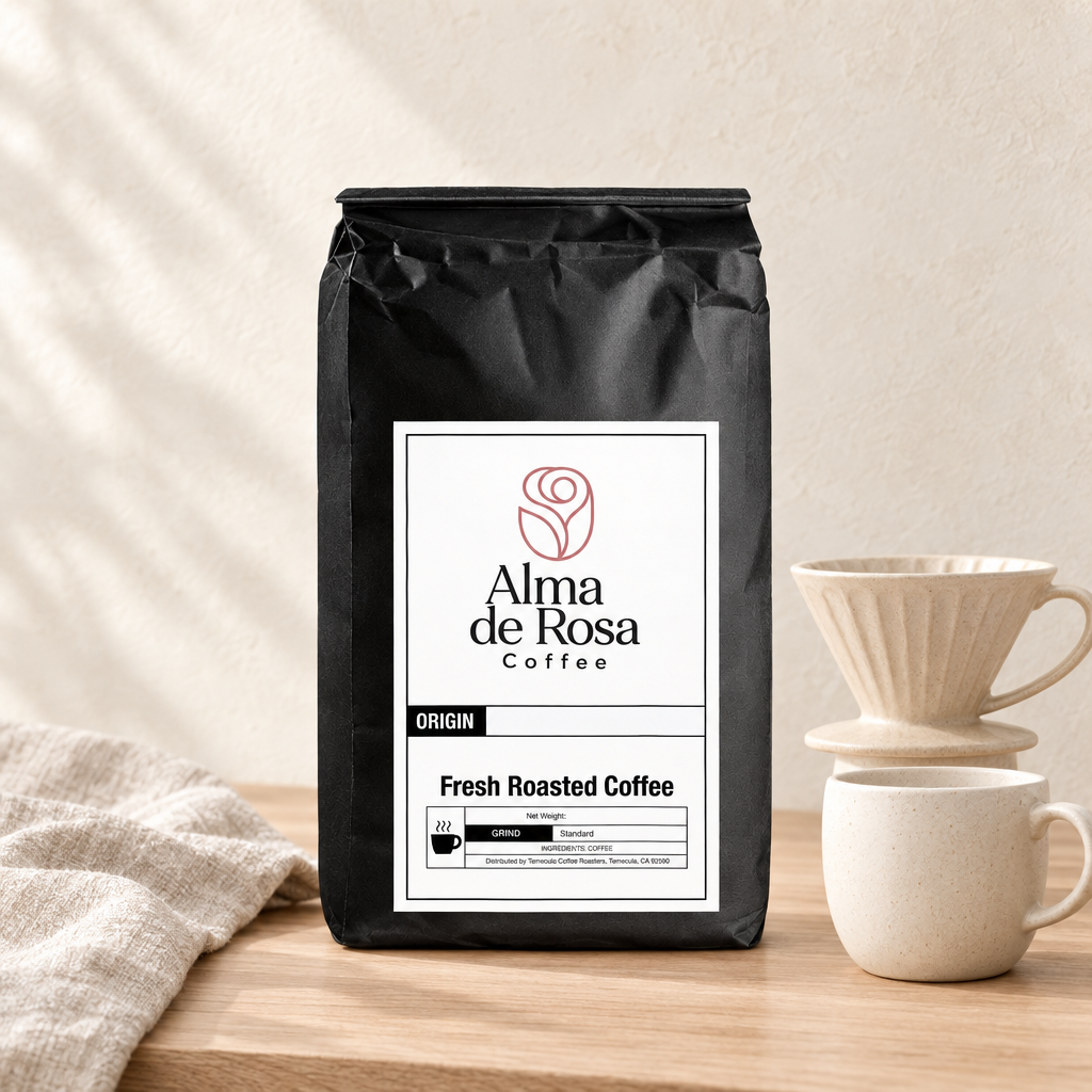 Alma de Rosa Blonde Roast coffee bag with pale pour-over ceramics on natural oak